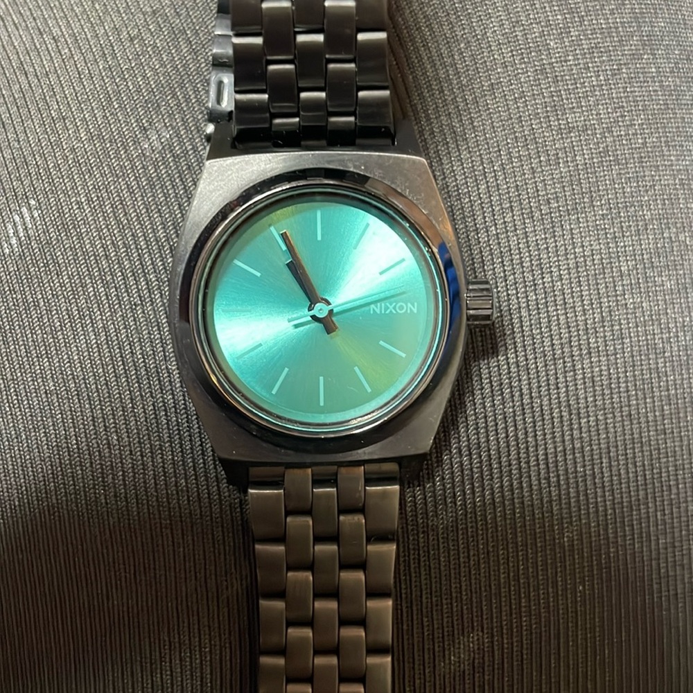 Nixon small time teller watch. Gunmetal grey/black with turquoise face